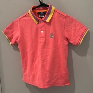 Bright coral/pink Psycho Bunny youth Polo.